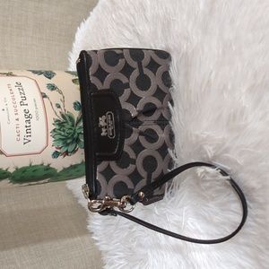Coach wristlet. Horse and Carriage Coach logo on front
